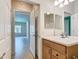 Bathroom featuring wood vanity, modern fixtures, and tile flooring at 9582 Sw 70Th Loop, Ocala, FL 34481