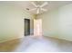This bedroom has a closet and a ceiling fan at 9582 Sw 70Th Loop, Ocala, FL 34481