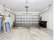 Spacious two-car garage with overhead door, ample storage space and high ceilings at 9582 Sw 70Th Loop, Ocala, FL 34481