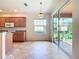 Open kitchen and dining area with sliding door to the sun room at 9582 Sw 70Th Loop, Ocala, FL 34481