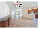 Spacious open-concept living room with tile flooring and kitchen access at 9582 Sw 70Th Loop, Ocala, FL 34481