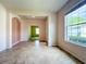 Bright living room with tile floors and large window offering plenty of natural light at 9582 Sw 70Th Loop, Ocala, FL 34481