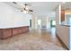 Spacious living area with tile flooring, built-in cabinetry, and access to other rooms in the home at 9582 Sw 70Th Loop, Ocala, FL 34481
