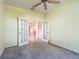 Carpeted room featuring glass paneled French doors at 9582 Sw 70Th Loop, Ocala, FL 34481