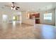 Expansive living room with tile flooring, adjacent to the kitchen and other living spaces at 9582 Sw 70Th Loop, Ocala, FL 34481
