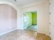 Home office showcasing French doors, neutral walls, and plush carpeting for a professional space at 9582 Sw 70Th Loop, Ocala, FL 34481
