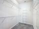 Spacious walk-in closet with wall-mounted wire shelves, and carpeted flooring at 9582 Sw 70Th Loop, Ocala, FL 34481