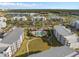 Stunning aerial view of modern apartment buildings surrounding a beautiful pool area and lush green spaces at 3120 Paradox Cir # 307, Kissimmee, FL 34746