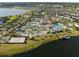Aerial view of a resort style community with a lazy river, beach volleyball, and other amenities at 3120 Paradox Cir # 307, Kissimmee, FL 34746