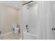 Bright bathroom featuring a shower and tub combination and a low flow toilet at 3120 Paradox Cir # 307, Kissimmee, FL 34746