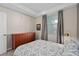 Bedroom with a large window, plush carpeting, and a low profile dresser at 3120 Paradox Cir # 307, Kissimmee, FL 34746