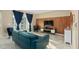 Comfortable living room featuring stylish blue furnishings, and access to a balcony at 3120 Paradox Cir # 307, Kissimmee, FL 34746