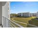 Building view from balcony featuring a large grassy common area and a swimming pool at 3120 Paradox Cir # 307, Kissimmee, FL 34746