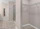 Large walk-in closet with wire shelving and neutral colored walls at 3120 Paradox Cir # 307, Kissimmee, FL 34746