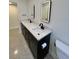 Modern bathroom features a dual sink vanity with white countertop and matte black fixtures at 3610 Pershing Ave, Orlando, FL 32812