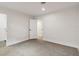 Bright bedroom with closet, doors, and speckled flooring at 3610 Pershing Ave, Orlando, FL 32812
