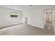 Bright bedroom with speckled flooring, closet, and window at 3610 Pershing Ave, Orlando, FL 32812