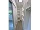 White walk-in closet with custom shelving and storage with a sliding door at 3610 Pershing Ave, Orlando, FL 32812