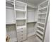 Walk-in closet with white shelving and drawers for optimal storage at 3610 Pershing Ave, Orlando, FL 32812