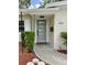 A modern front door with a stylish design and neatly trimmed landscaping at 3610 Pershing Ave, Orlando, FL 32812