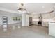 Modern kitchen featuring stainless steel appliances, white cabinetry, and stylish lighting at 3610 Pershing Ave, Orlando, FL 32812