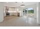 Modern kitchen featuring stainless steel appliances, white cabinetry, and stylish lighting at 3610 Pershing Ave, Orlando, FL 32812