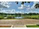 Beautiful lake view with calm waters and lush reeds on the shore at 3610 Pershing Ave, Orlando, FL 32812