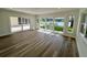 Bright living room with wood floors and sliding glass doors with a water view at 3610 Pershing Ave, Orlando, FL 32812