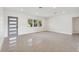 Bright living room with polished concrete floors and minimalist design with natural light at 3610 Pershing Ave, Orlando, FL 32812