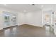 Bright living room with speckled flooring, and exterior doors at 3610 Pershing Ave, Orlando, FL 32812