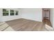 Bright and well-lit room with modern wood flooring and large windows at 3610 Pershing Ave, Orlando, FL 32812