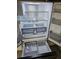Interior view of the refrigerator showing adjustable shelves, drawers, and ice maker at 3610 Pershing Ave, Orlando, FL 32812