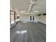 Spacious sun room featuring skylights, ceiling fans and views of backyard at 3610 Pershing Ave, Orlando, FL 32812