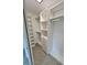 Bright walk-in closet featuring custom shelving, drawers, and ample storage space at 3610 Pershing Ave, Orlando, FL 32812