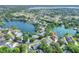 Beautiful aerial view of a lakeside community with mature trees and stunning water access at 5810 Lake Victoria Dr, Lakeland, FL 33813