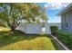 Private backyard featuring a lawn, trees, fencing, and water view at 5810 Lake Victoria Dr, Lakeland, FL 33813