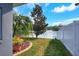 Beautiful backyard view of a lake with a fountain and nice landscaping at 5810 Lake Victoria Dr, Lakeland, FL 33813