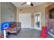 Fun bedroom features a basketball theme with a sport court flooring, and a red brick accent wall at 5810 Lake Victoria Dr, Lakeland, FL 33813