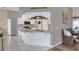 Well-lit kitchen with stainless steel appliances, white cabinets, and a decorative wreath and bench at 5810 Lake Victoria Dr, Lakeland, FL 33813