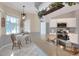 Bright eat-in kitchen featuring white cabinets, stainless appliances, and a charming breakfast nook at 5810 Lake Victoria Dr, Lakeland, FL 33813