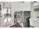 Convenient laundry room with modern washer and dryer, sink, and plenty of storage space at 5810 Lake Victoria Dr, Lakeland, FL 33813