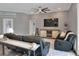 Comfortable living room showcasing hardwood floors, gray walls, and neutral decor at 5810 Lake Victoria Dr, Lakeland, FL 33813