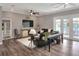 Cozy living room with hardwood floors, gray walls, and comfortable seating at 5810 Lake Victoria Dr, Lakeland, FL 33813