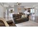 Expansive living room features wood floors, ceiling fan, modern furniture, and an open concept at 5810 Lake Victoria Dr, Lakeland, FL 33813
