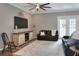 Inviting living room features a decorative ceiling fan, stylish furniture and elegant neutral color palette at 5810 Lake Victoria Dr, Lakeland, FL 33813