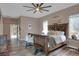 Spacious bedroom showcasing a rustic bed frame, wood floors, and ample natural light at 5810 Lake Victoria Dr, Lakeland, FL 33813