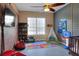Fun playroom featuring a TV, bookcase, and assorted toys and equipment at 5810 Lake Victoria Dr, Lakeland, FL 33813