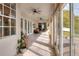 Outdoor sunroom features tile floors, many windows for natural light, and french doors to the outside at 5810 Lake Victoria Dr, Lakeland, FL 33813