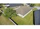 Aerial shot of the backyard, showcasing the expansive green space and surrounding neighborhood at 3657 Daydream Pl, St Cloud, FL 34772