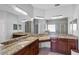 Bathroom featuring dual sinks, granite counters, mirrors, and tile flooring at 3657 Daydream Pl, St Cloud, FL 34772